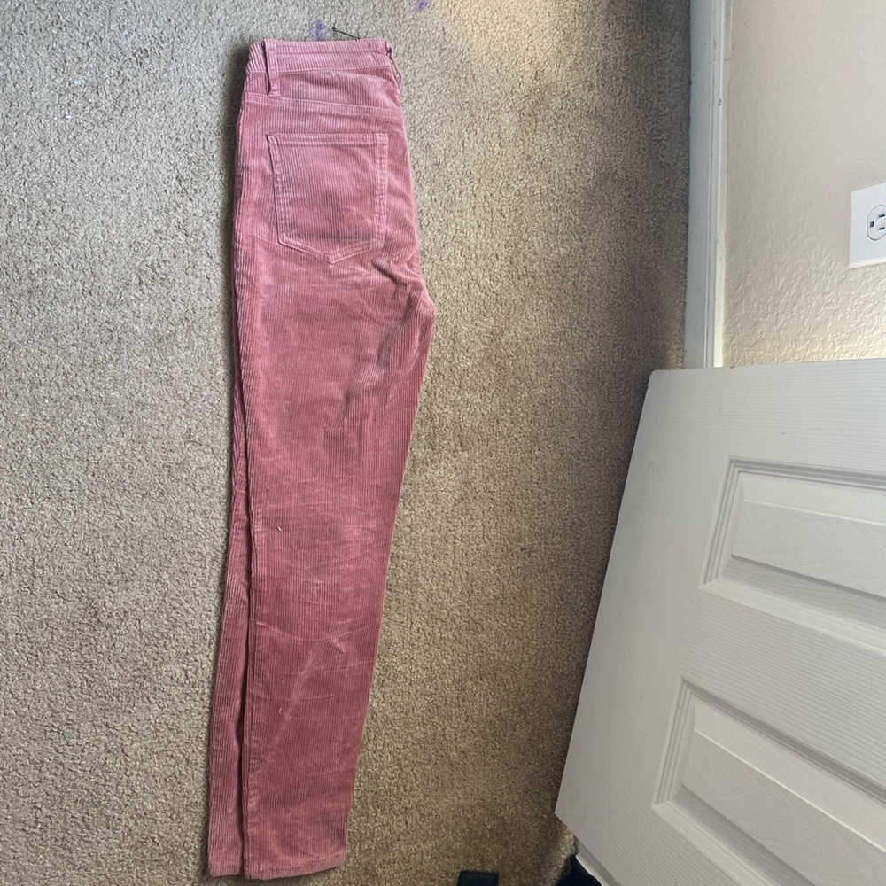 Salmon colored skinny and stretchy corduroy pants